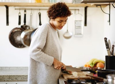 woman cutting vegetable