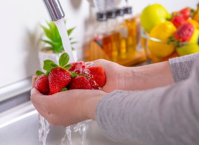 rinsing strawberries