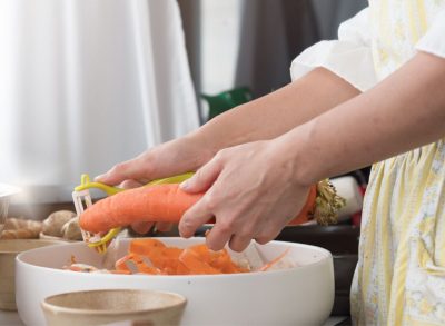 using kitchen tools on veggies