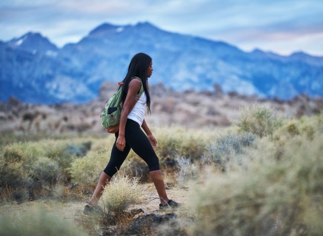 woman on hike demonstrating little-known habits to reduce fat on her legs