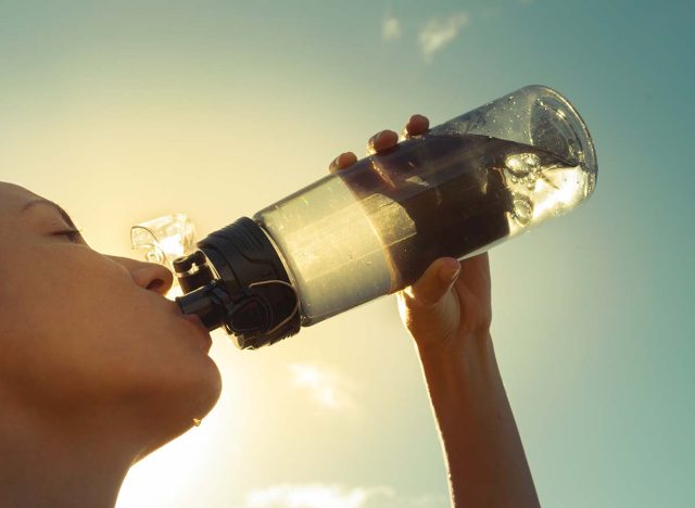 The 30 Best Foods for Weight Loss - Drinking out of large water bottle