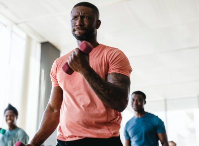 fit man in his 40s performing strengthening workout to slow down aging after 40