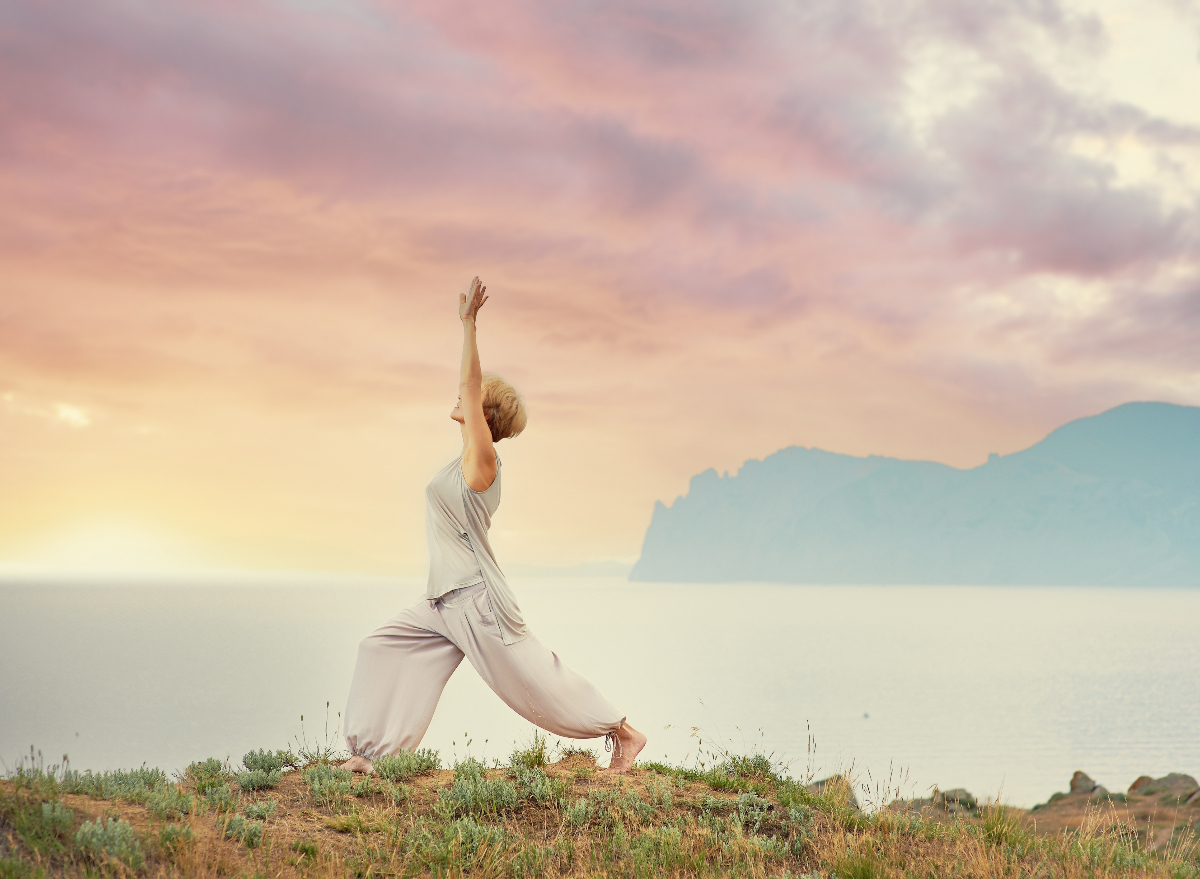 mature-woman-morning-yoga-mountains.jpg?quality=82%5Cu0026strip=all