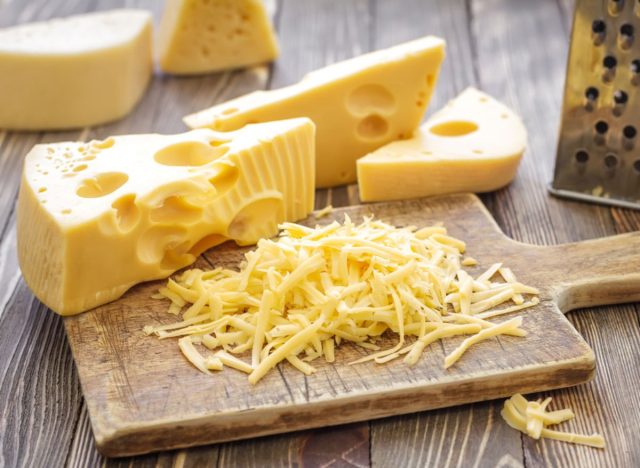swiss cheese on a cutting board