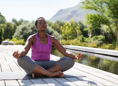 woman peaceful meditation, concept of how to melt your belly bulge on autopilot