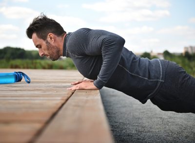 middle-aged man demonstrating resistance training workout to improve your heart health