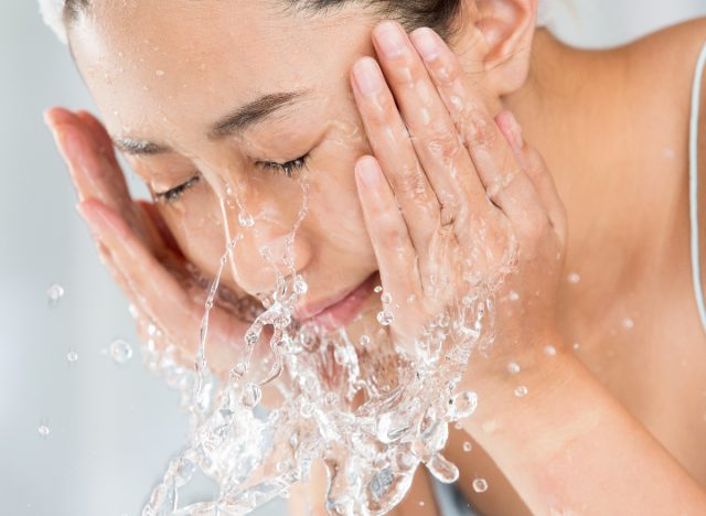 woman washing her face, over-washing concept of bad hygiene habits