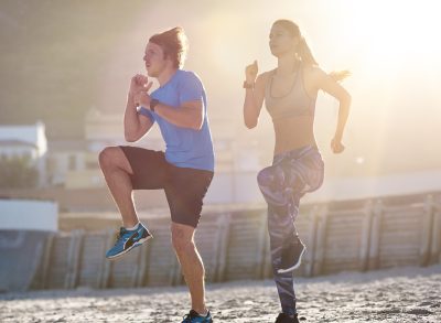 active couple performing quick five-minute cardio workout in the morning