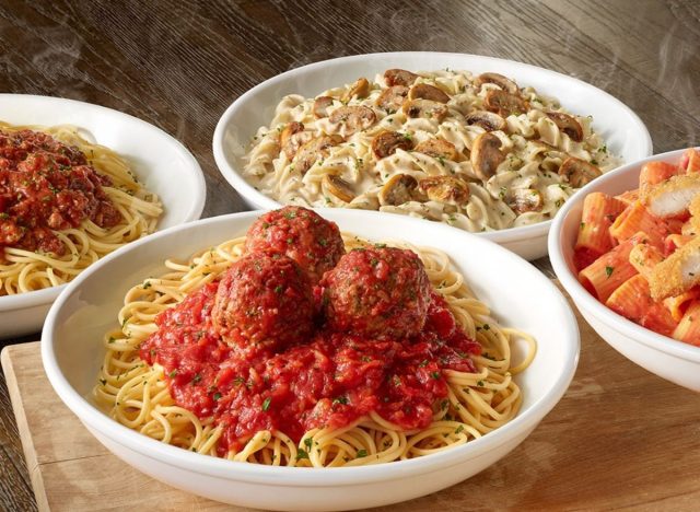 bowls of Olive Garden pasta on a table