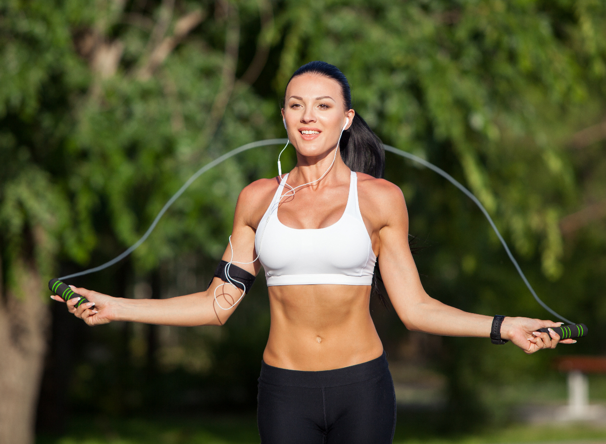 https://www.eatthis.com/wp-content/uploads/sites/4/2023/03/fit-woman-jumping-rope.jpg?quality=82&strip=1