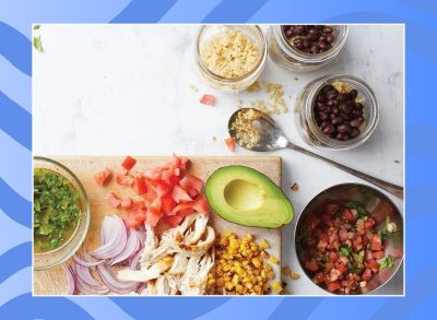 mexican food ingredients on a white countertop with blue background