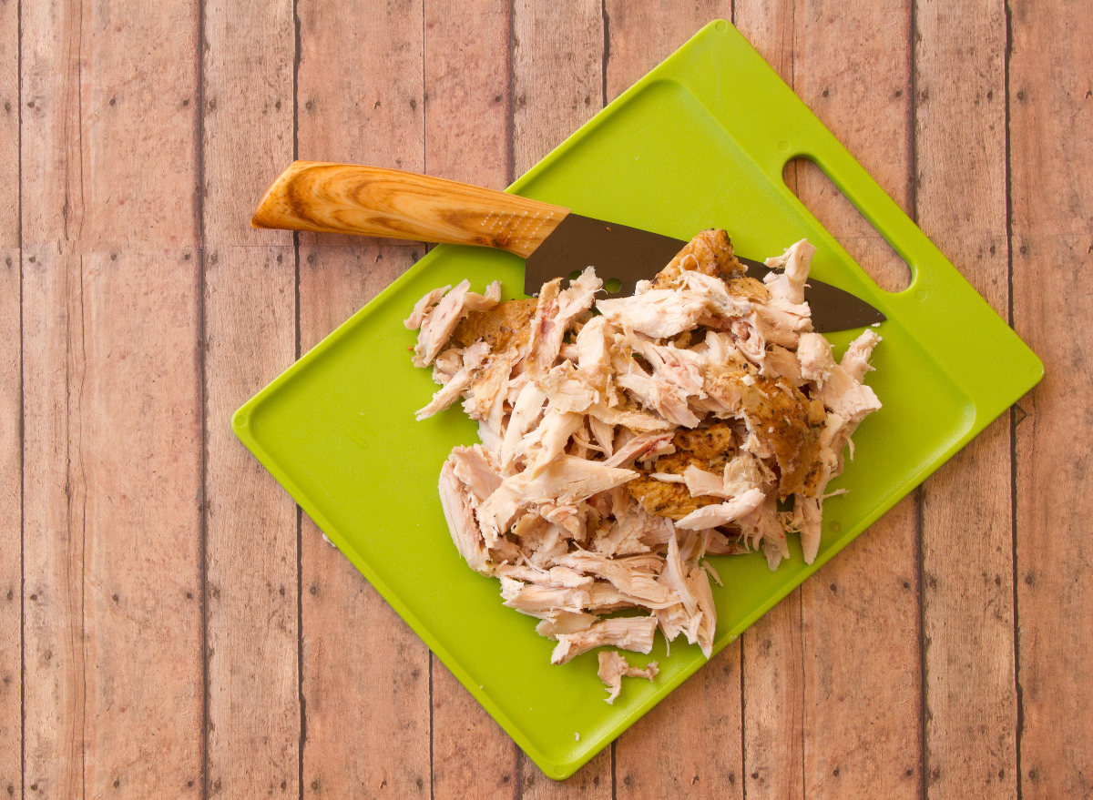 How Long Is Rotisserie Chicken Good For Food Experts Weigh In   Shredded Rotisserie Chicken Cutting Board 