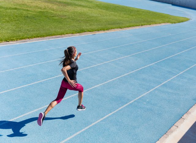 woman sprinting track
