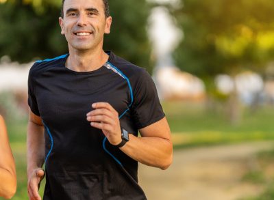 mature man running outdoors, concept of fitness habits to build endurance and stamina