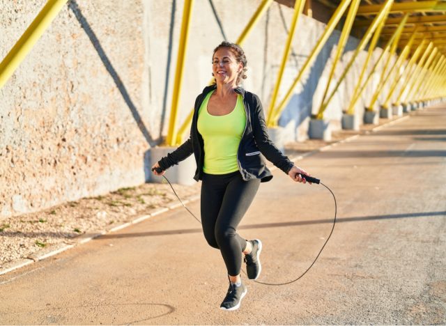 You Can Burn Belly Fat in 10 Minutes or Less With These 7 Exercises - middle-aged woman jumping rope for exercise to improve stamina