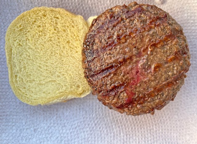 A freshly grilled Wegmans Signature Plain Beef Patty served on a bun