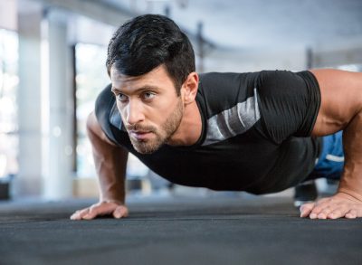 close-up man doing pushups, concept of test how fit you are with strength workout