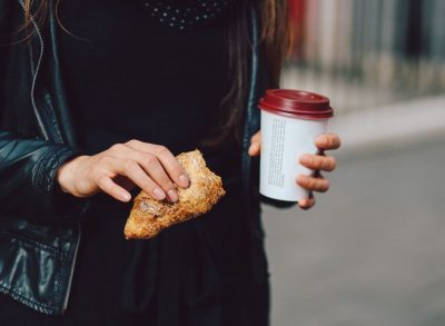 holding a baked good