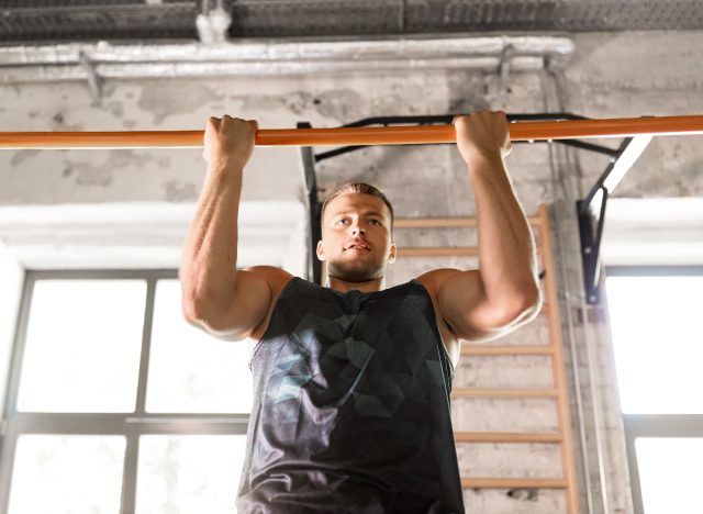 fit man doing close-grip pull-ups, concept of strength workout for every part of your body