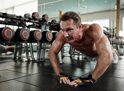 fit man doing three-point pushups, concept of daily bodyweight workout for men to stay muscular after 40