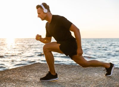 man doing walking lunges exercise, concept of best exercises if you're out of shape after 40