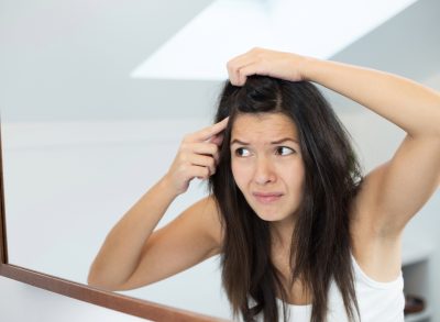 worried woman spotting a gray hair