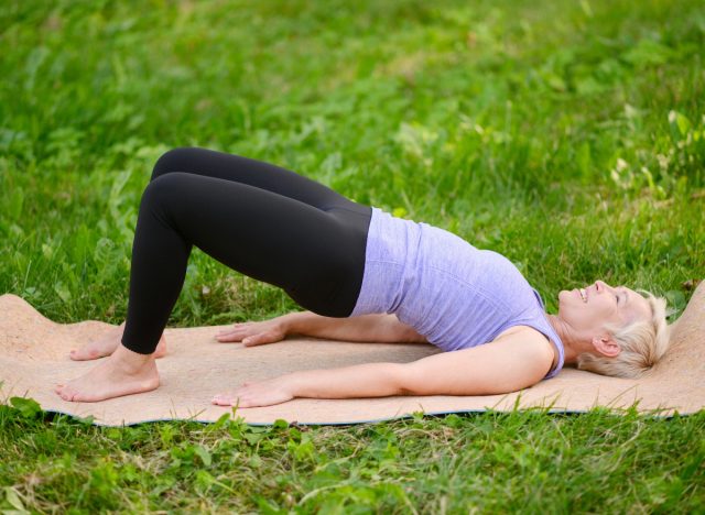 woman doing glute bridges, concept of floor exercises to lose 10 pounds in a month