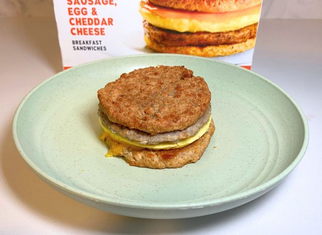 https://www.eatthis.com/wp-content/uploads/sites/4/2023/10/Realgood-Sausage-Egg-Cheddar-Cheese-breakfast-sandwich.jpg?quality=82&strip=all&w=640