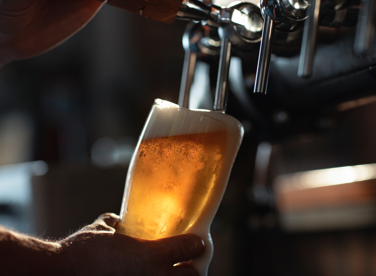 pouring beer from a tap