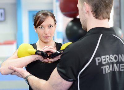 woman working out with personal trainer