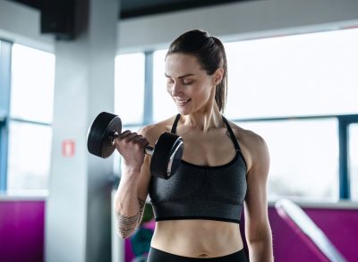 woman lifting weights, concept of the 75 Soft Challenge