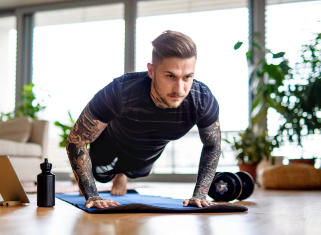 man doing pushups, concept of five-move workout to build total-body strength at home