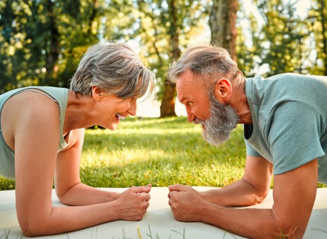 mature couple doing planks