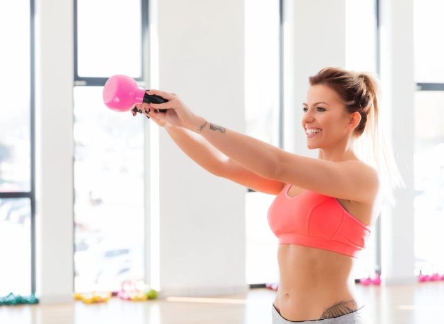 https://www.eatthis.com/wp-content/uploads/sites/4/2024/02/woman-kettlebell-swing.jpeg?quality=82&strip=all&w=640&h=468&crop=1