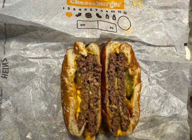 burger king double cheeseburger cut open on a wrapper.