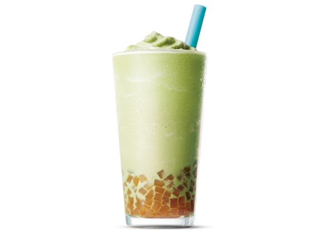 glass of. caribou coffee frozen matcha tea with bubbles