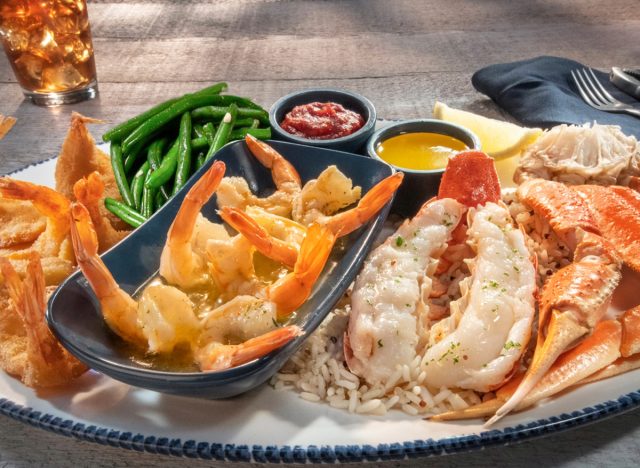 red lobster's ultimate feast with two types of shrimp, lobster, crab, rice, green beans, and dipping sauces