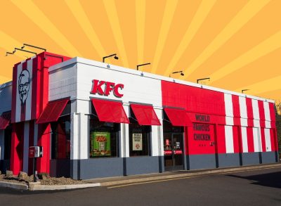 KFC restaurant exterior on striped orange-yellow background