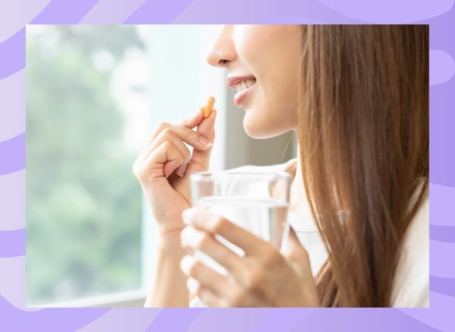 woman taking a supplement