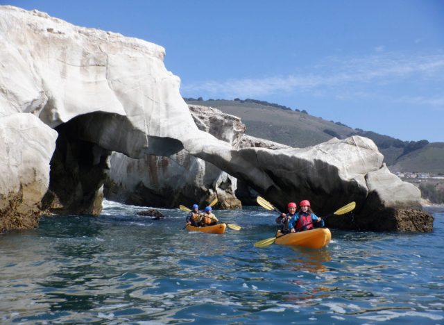 two kayaks kayaking through coves on a sunny day in SLO