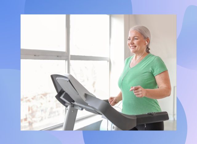 mature, happy woman doing treadmill workout in front of bright window in home