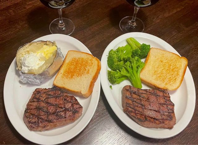 Two steaks with side dishes from Grecian Steak House in Pickneyville, Ill.