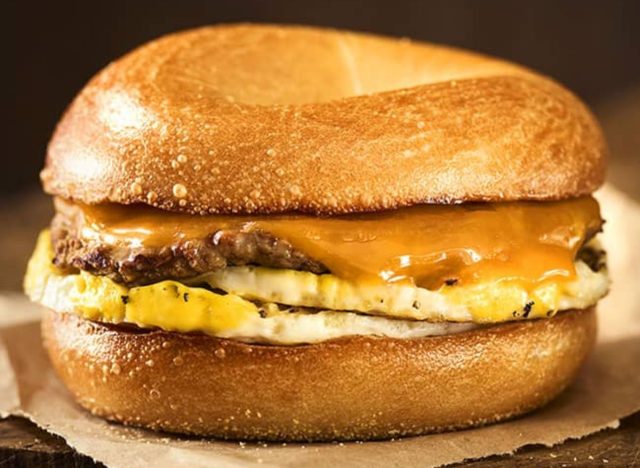 Einstein breakfast sandwich with sausage, egg, and cheese