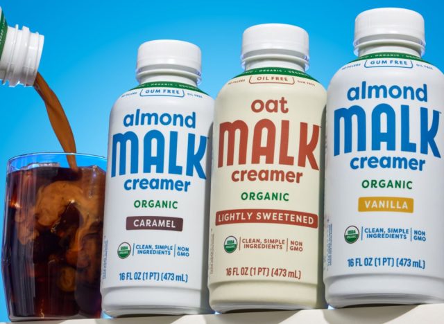 bottles of Malk creamer with a blue background