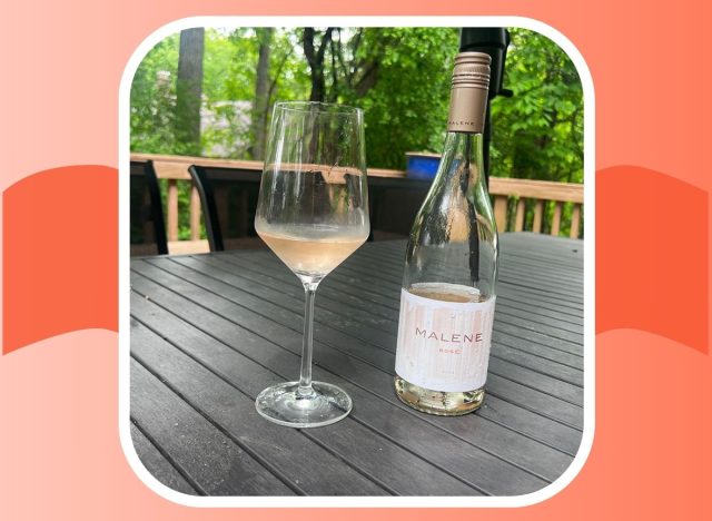 A bottle of Malene Rose 2023 next to a glass of the pink-colored wine.