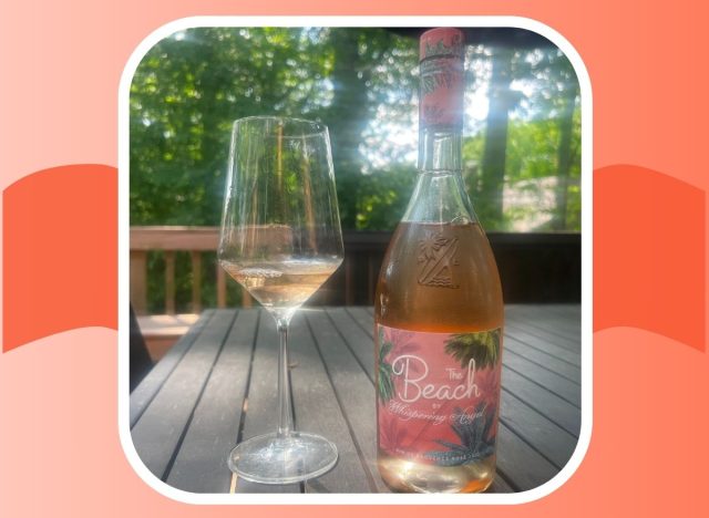 a bottle and glass of the beach rose wine 