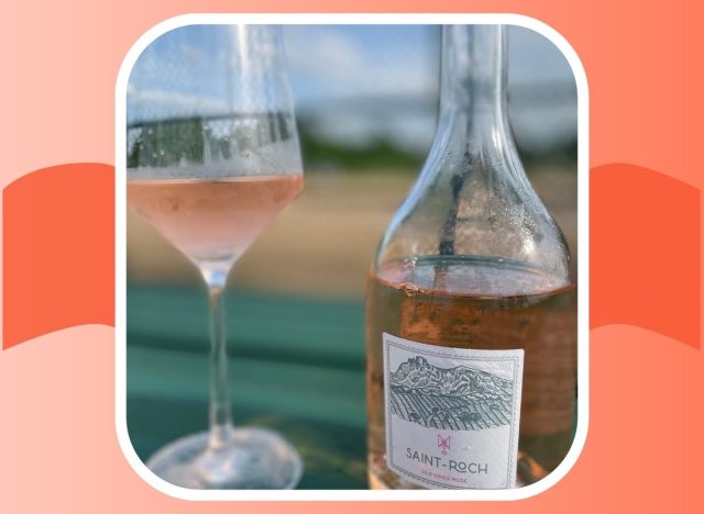 A bottle of Saint Roch Old Vine Rose next to a glass of the pink-tinted wine