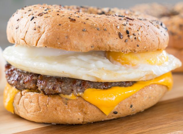 Sausage, egg and cheese breakfast sandwich on an everything bagel