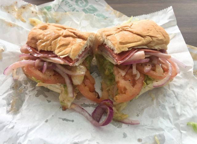 Two halves of an Italian sub sandwich from Subway