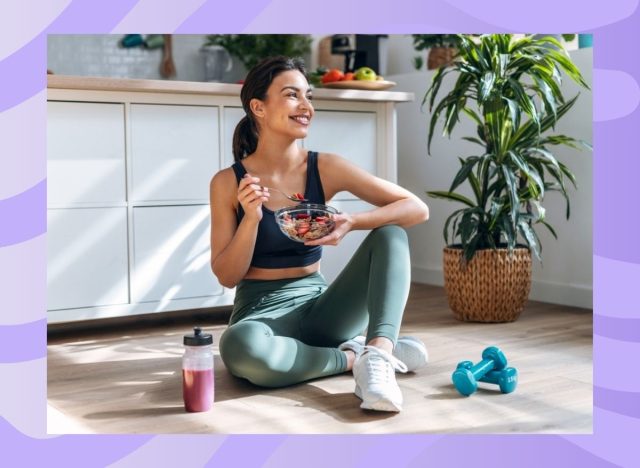 woman eating a bowl of food in the kitchen